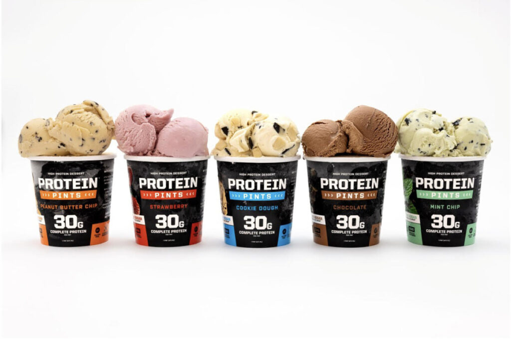 Five flavors of protein ice cream pints with 30 grams of complete protein each, including peanut butter chip, strawberry, cookie dough, chocolate, and mint chip.